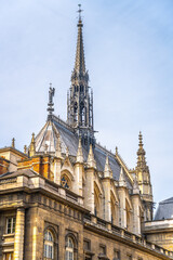 Exterior of Sainte-Chapelle with narrow and spiky spire. Palais de la Cite, Paris, France