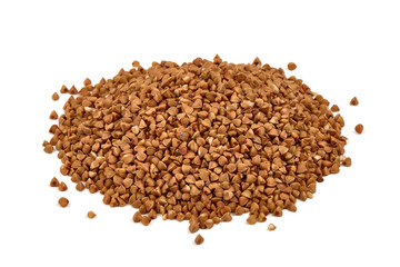 Raw buckwheat grains, isolated on white background.