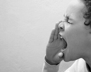boy shouting with open mouth on white background with people stock photo  