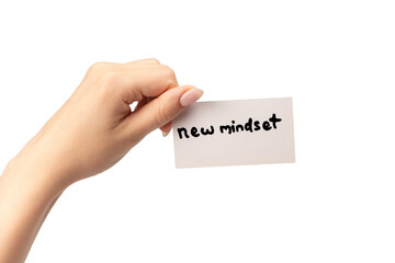 New mindset - new result  text on a card in a woman hand.