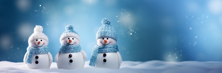 Adorable and happy snowman family on Christmas snowy background, get together and celebrating holiday seasons, with copy space, idea for greeting cards and posters.