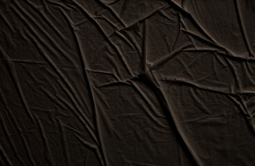 Empty crumpled wet black brown paper blank texture copy space wall background.