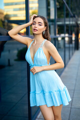 Beautiful girl in a blue dress outdoor