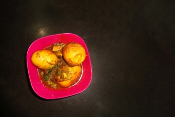 Cooked Eggs on a pink bowl from top shot