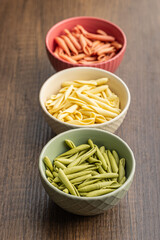 Fusilli pugliesi. Italian tricolor twisted pasta in bowl.