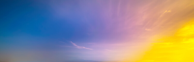 Blue Blurry yellow light soft panorama sunset sky background with yellow clouds