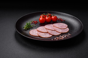 Delicious fresh ham cut into round slices with salt, spices and herbs