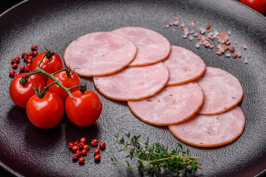 Delicious fresh ham cut into round slices with salt, spices and herbs