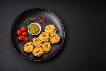 Delicious fresh pasta consisting pesto sauce with salt, spices and herbs