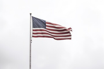 A bright flag flutters proudly in the open sky, its pole standing strong and resilient in the outdoors