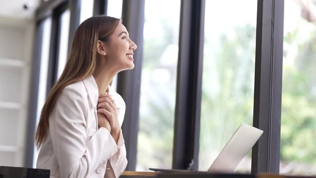 Business women celebrating job successful, reading good news on laptop, happy and excited gesture.