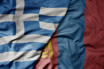 big waving national colorful flag of greece and national flag of mongolia .