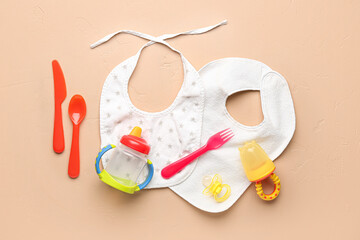 Set of different baby accessories on color background