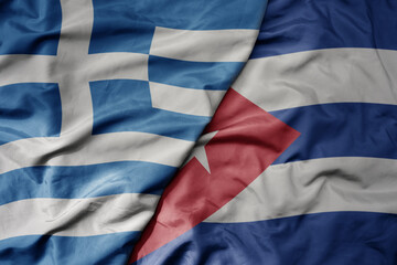 big waving national colorful flag of greece and national flag of cuba .