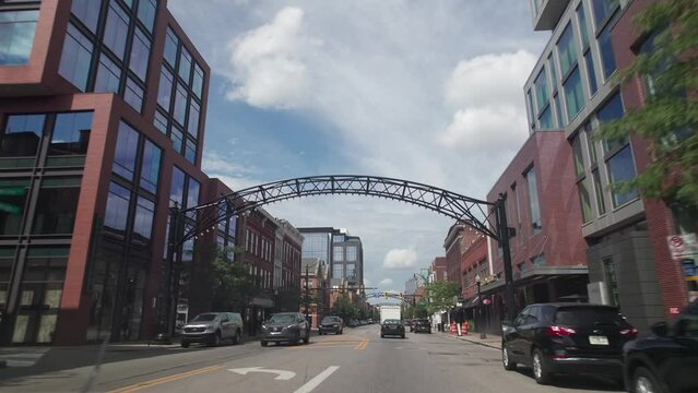 Columbus, Ohio  United States - September 6 2023: Car driver point of view moving north up High Street through Short North Arches by Columbus, Ohio with traffic, bars, art galleries, and restaurants