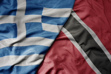 Obraz premium big waving national colorful flag of greece and national flag of trinidad and tobago .