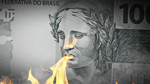 Brazil money is burning in the fire, the concept of economic crisis of inflation and currency devaluation Brazil currency burning