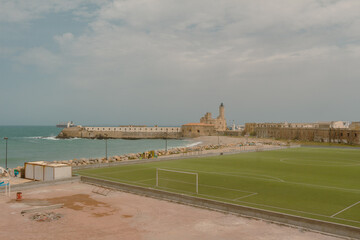 Football field and the Lighthouse of the Admiralty in the background, Algiers, Alger, Algeria.