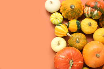 Fresh pumpkins on orange background