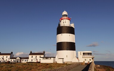Fototapeta na wymiar Lighthouse at Hook Head Co. Wexford the oldest in Ireland and one of the oldest in the world.