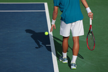 tennis player preparing to serve