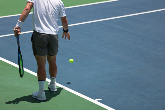 tennis player preparing to serve