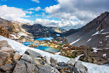 Fototapeta na wymiar Alpine lakes from a view, snow, mountains