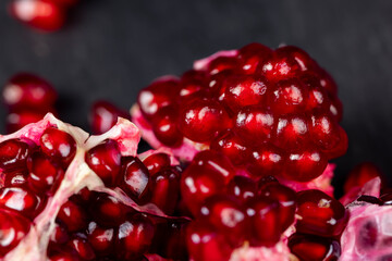 peeled red ripe pomegranate with red sweet grains
