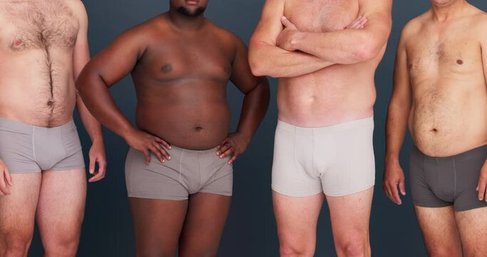 Men, body positivity and community with diversity, confidence and plus size in studio with underwear. Male group and grey background with friends, people and pride together with solidarity and model