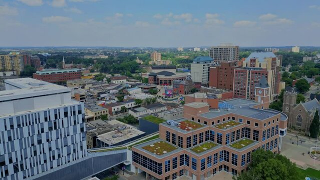 Low level aerial view of downtown Brampton Ontario. Prominently featured in the video clip is City Hall, Garden Square, and The Rose Theatre.