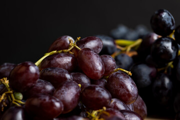Ripe fresh grapes on a board