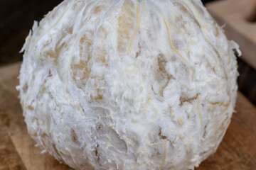 peeled pomelo on the table, close up