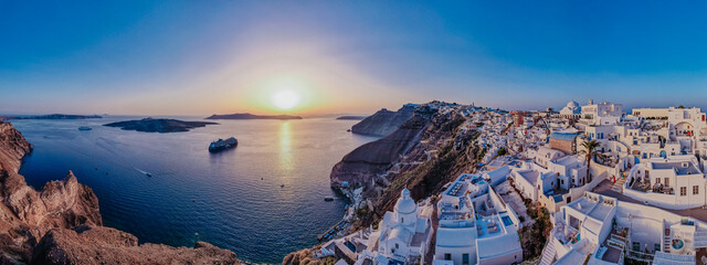 Panoramic aerial view of sunset seen from Santorini island, Greece.