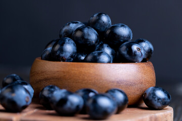 Unwashed blue grapes in the dust
