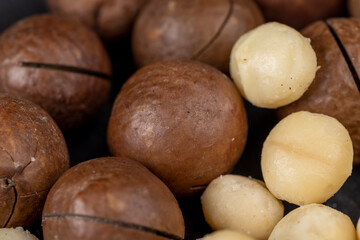 Unpeeled macadamia nuts on the table