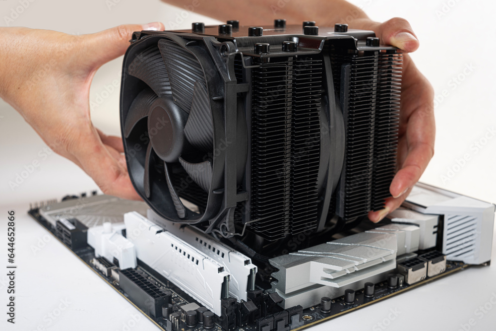Poster installing a large air cooler on a computer processor.