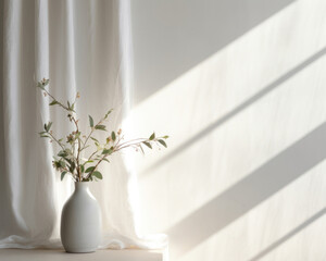 This scene showcases a product presented on a light gray textured fabric against a white wall. The gentle light from the window casts delicate, diffused shadows, giving a sense of softness