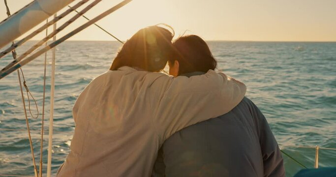 Back, lesbian couple and hug on yacht at sunset, bonding and care, support or trust together. Gay, women and embrace on boat, intimate and love of lgbtq people on ocean cruise, travel and vacation