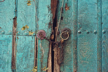 Old, colorful wooden door with lock - fairytale door to a world of fantasy