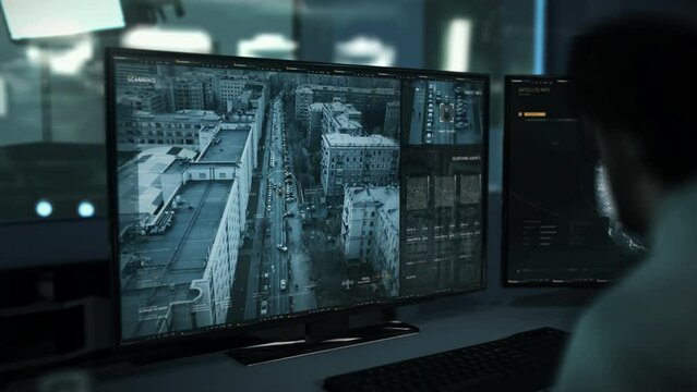 Hi-tech data analysis system is supervising the urban city. Hi-tech data analysis software looking for criminals. Hi-tech data analysis system locates the suspects in the car on the busy city road. UI