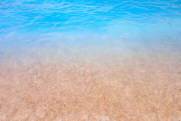 Seashore of small white pebbles on the beach in Oludeniz, blue lagoon. The cleanest beach with blue flag. Background