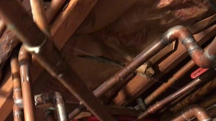 water leak gushing through pinhole in copper pipe in house