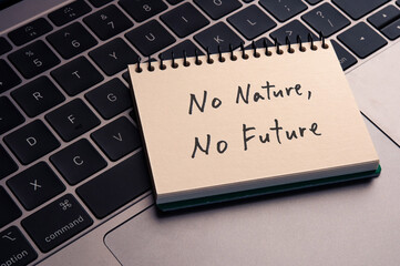 There is notebook with the word No nature, No future. It is as an eye-catching image.