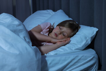 Little girl snoring while sleeping in bed at home