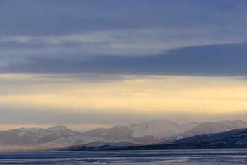 Fototapeta na wymiar blue sky over an icy lake