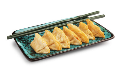 Delicious gyoza (asian dumplings) and chopsticks isolated on white