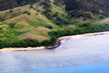fiji beach and green mountains, aerial