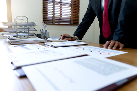 close up image of manager on desk, executive marketing analyst
