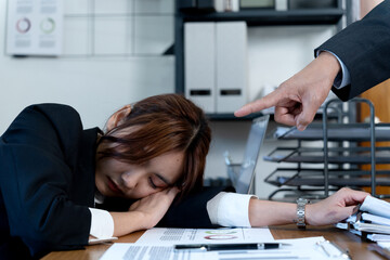 boss or chief catches employee sleeping in the office by pointing