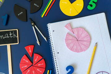 Сolorful math fractions on blue background. interesting math for kids. Education, back to school...